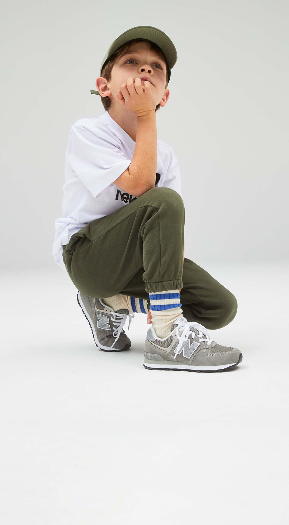 kid wearing nb 574 